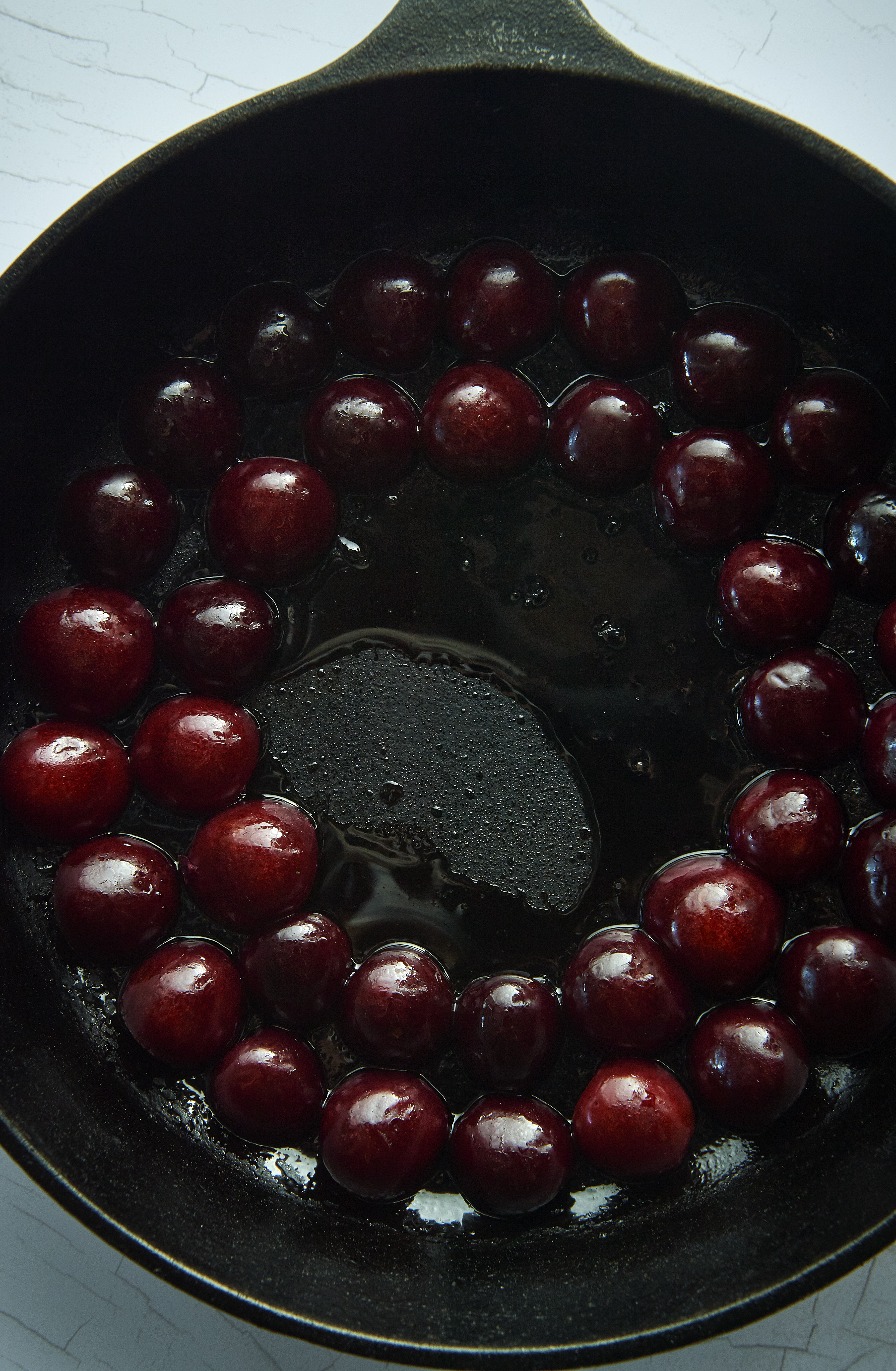 Lychees, cherries and rose petals with tahini and sesame cake