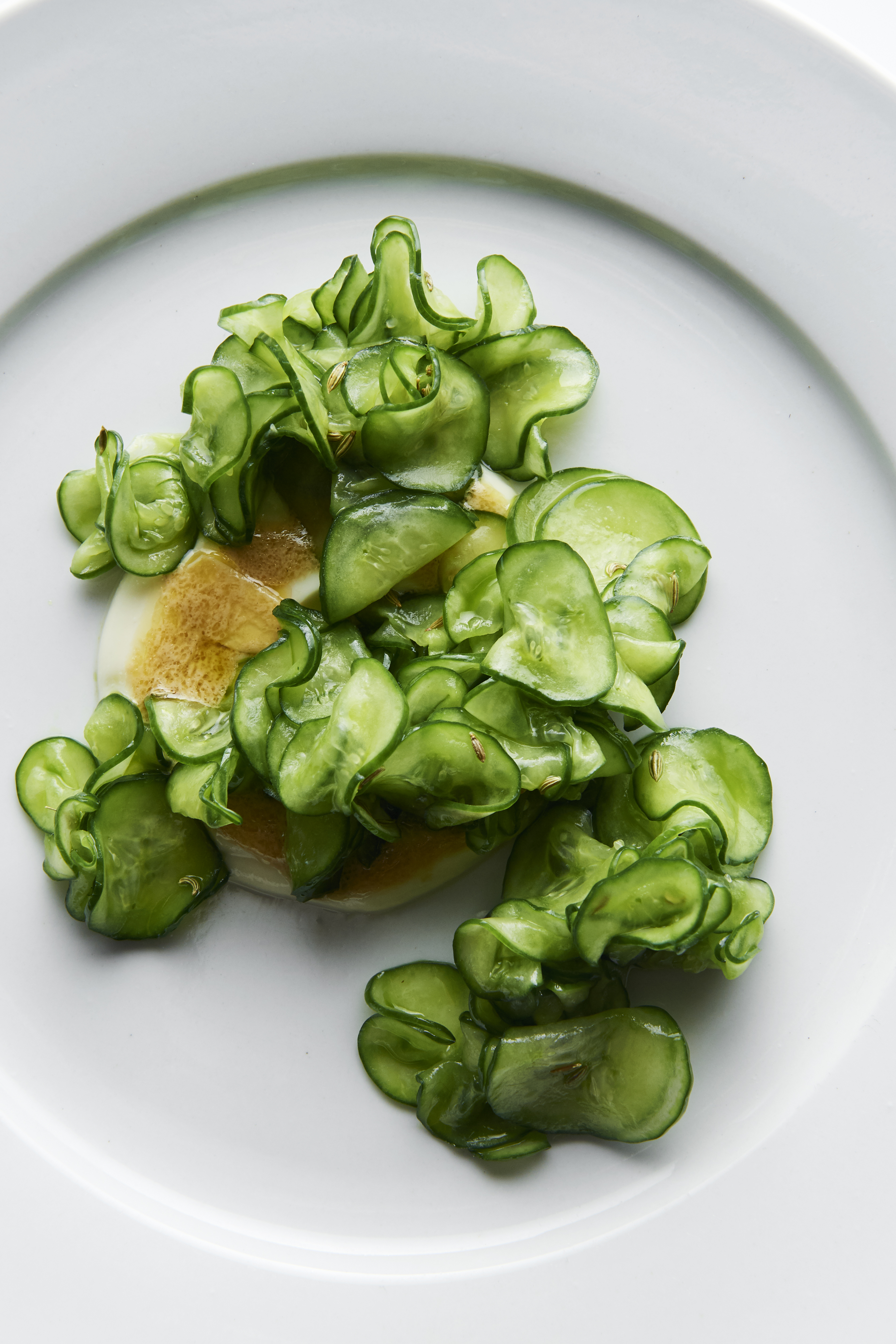 Almond cream with salted cucumber and dill oil