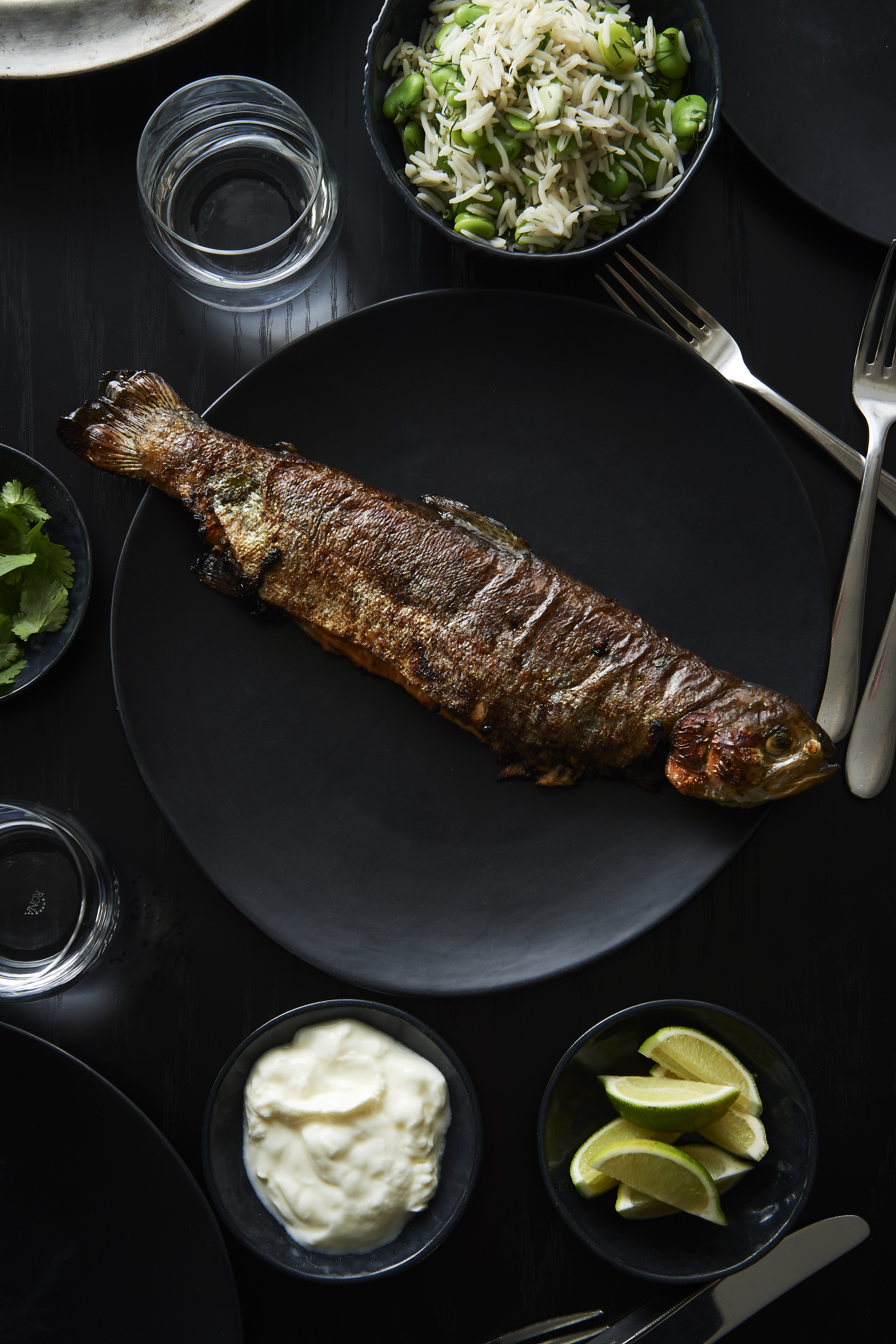 Stuffed rainbow trout with dill and broad bean pilaf