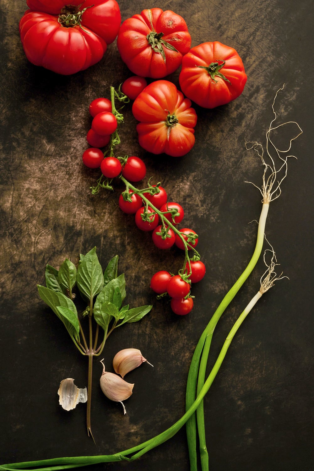 Burrata and tomato salad with sorrel and sesame dressing and crispy garlic oil