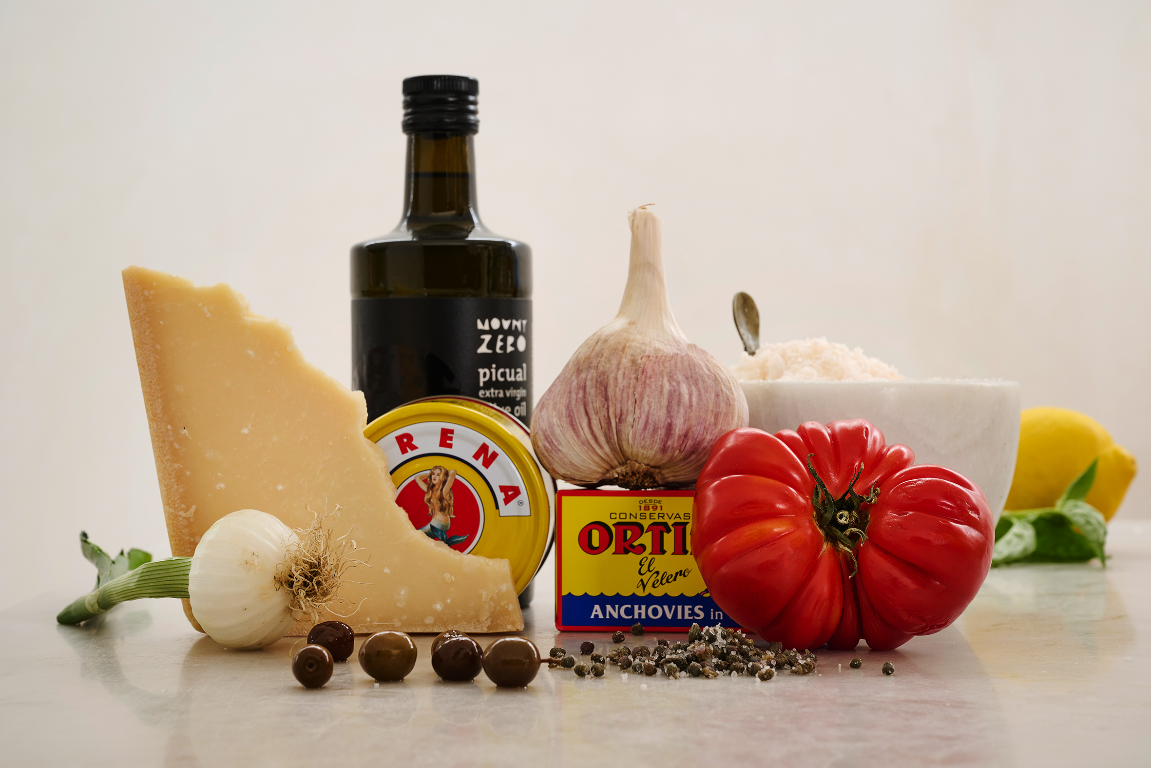 A block of cheese, olives, anchovies, garlic and salt.