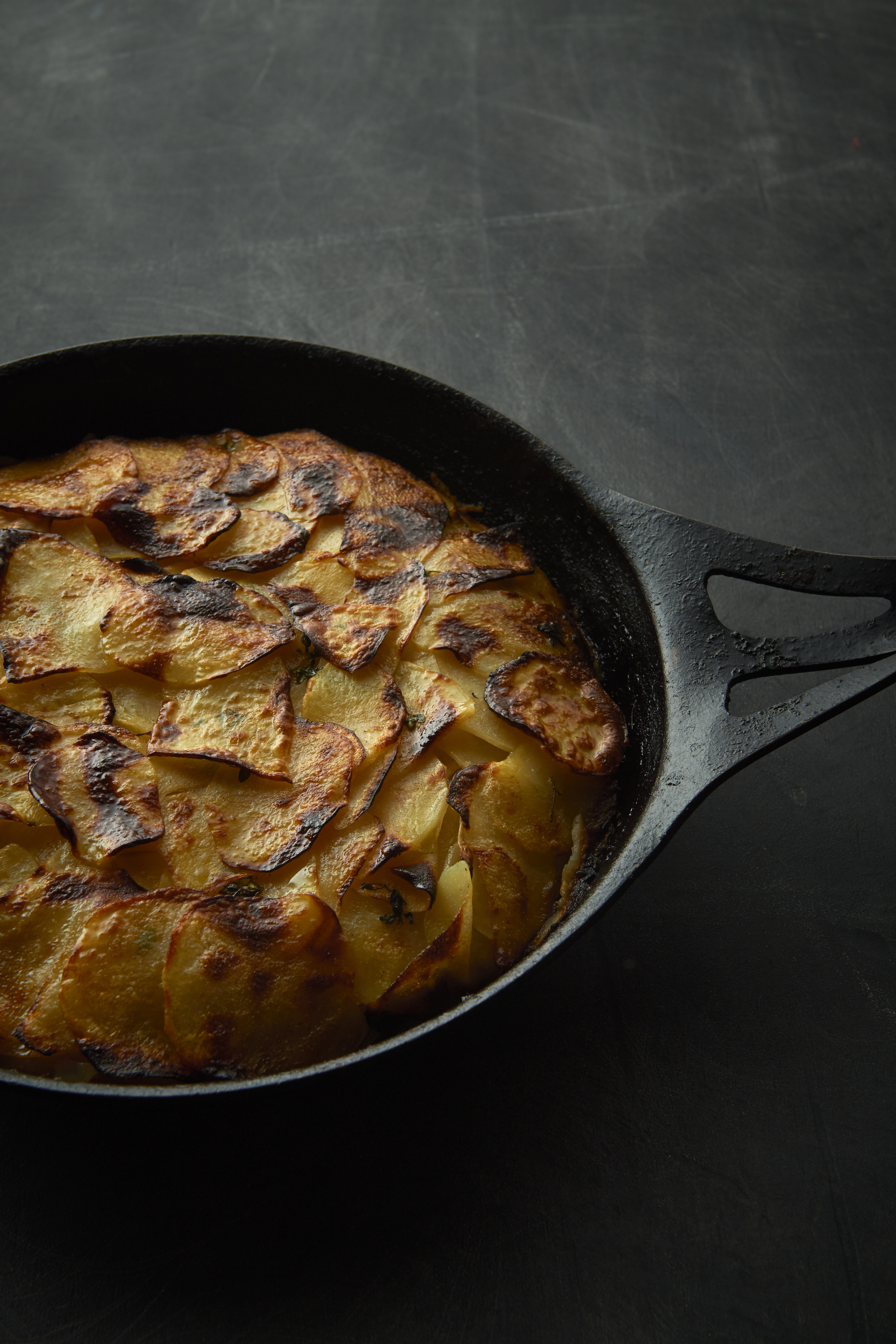 Baked celeriac and potatoes with honey, cinnamon and thyme