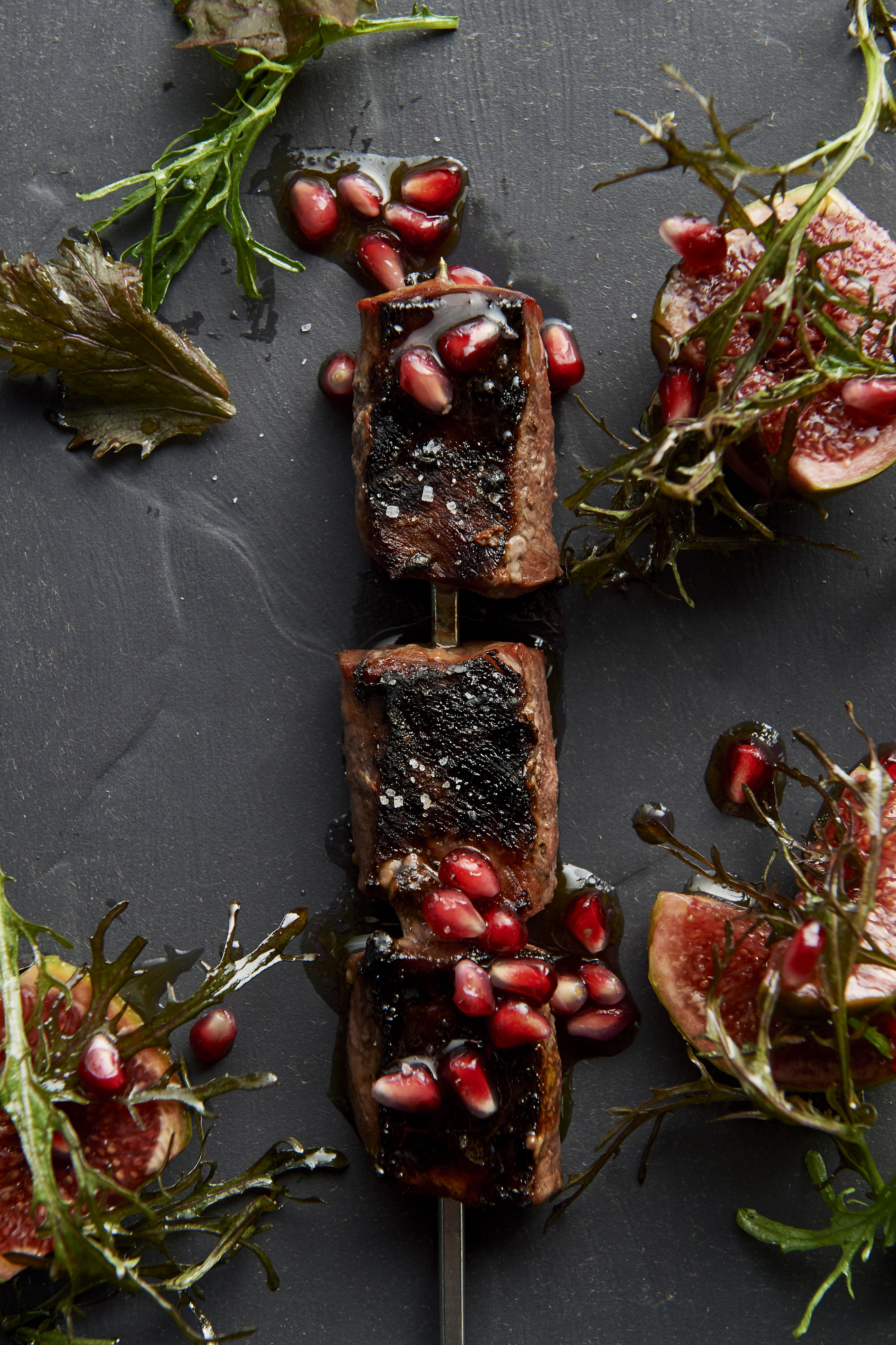 Grilled wild deer with pomegranate, fig and mustard leaf